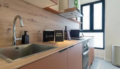 a kitchen with a sink and a counter top at Osito Hub - Duque de Gaeta in Valencia