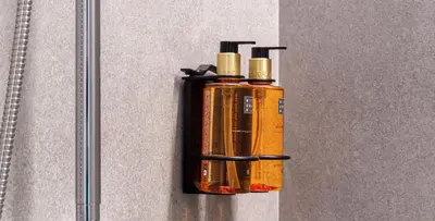an orange fire extinguisher hanging on a wall at Osito Hub - Duque de Gaeta in Valencia
