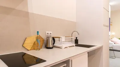 a kitchen with a sink and a counter top at Osito Hub - l'Explorador Andrés in Valencia