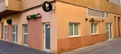 a building with a sign on the side of it at Osito Hub - l'Explorador Andrés in Valencia