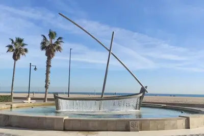 a statue of a boat on the beach at MalvaLindaBeach Loft Benlliure Malvarrosa/Patacona in Valencia