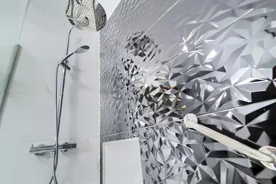 a shower in a bathroom with a glass wall at MalvaLindaBeach Loft Benlliure Malvarrosa/Patacona in Valencia