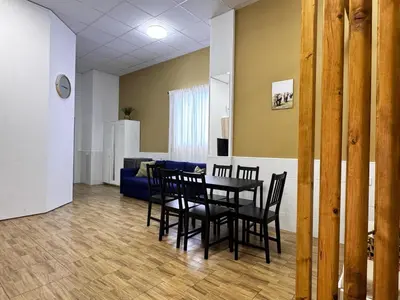 a dining room with a table and chairs and a couch at Cooperativa 8 in Valencia