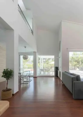 a living room with a couch and a table at Calma Villa. Chalet de lujo, jacuzzi y piscina in Valencia