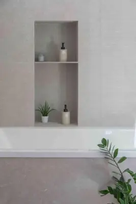 a white shelf with two candles and a plant on it at Calma Villa. Chalet de lujo, jacuzzi y piscina in Valencia