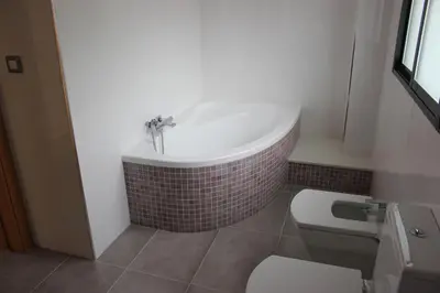 a bathroom with a bath tub and a toilet at Sierra de Chiva Villa in Chiva