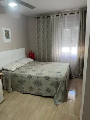 a bedroom with a bed and a window at Cullera Mountain View in Cullera
