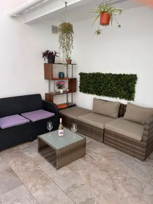 a living room with two couches and a table at Cullera Mountain View in Cullera