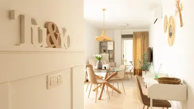 a kitchen and dining room with a table and chairs at Tú & Yo Moncofa in Moncófar