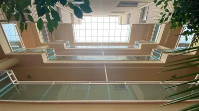 an empty room with stairs and windows in a building at Tú & Yo Moncofa in Moncófar