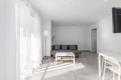 a living room with a couch and a table at Placid Puerto in Puerto de Sagunto