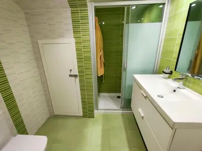 a bathroom with a toilet and a sink and a shower at Ca La Perla in Albalat de Taronchers
