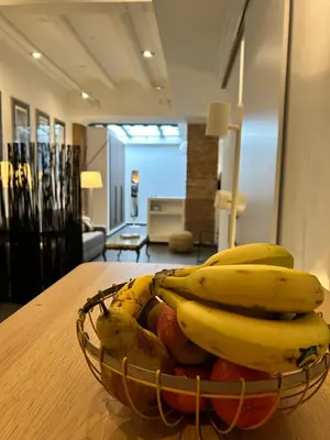 a basket of bananas and other fruit on a table at Apartamento chic en Ciutat Vella in Valencia