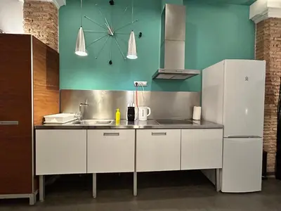 a kitchen with a sink and a refrigerator at Apartamento chic en Ciutat Vella in Valencia