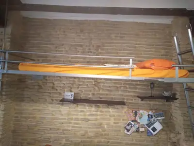 a bunk bed on top of a brick wall at Valencia Centro Suite in Valencia