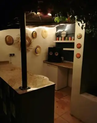 a kitchen with a counter top in a room at Casa el Girasol, rustig gelegen kindvriendelijke villa 10 p in Montroy