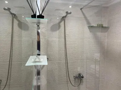a bathroom with a shower with a glass door at Encanto exclusivo en pleno centro de Valencia in Valencia