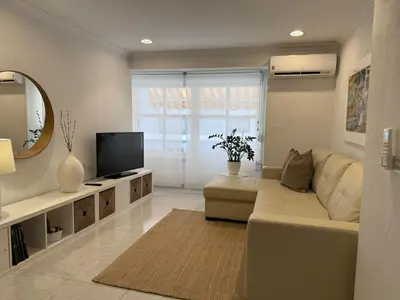 a living room with a couch and a television at Encanto exclusivo en pleno centro de Valencia in Valencia