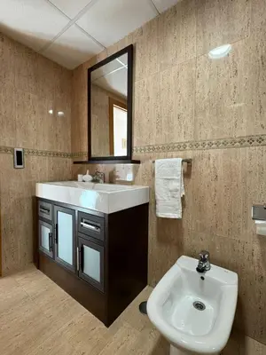 a bathroom with a sink and a mirror at Apto. Cullera vistas espectaculares primera línea in Cullera