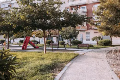a park with a playground with a slide at Acogedor loft en Cabañal playa Malvarosa in Valencia