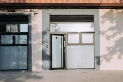 an open door of a building with two windows at Acogedor loft en Cabañal playa Malvarosa in Valencia