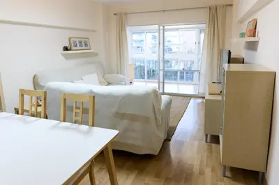 a small living room with a bed and a window at Apartamento pobla farnals playa precioso in Las Canteras
