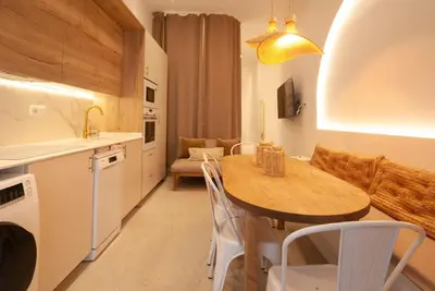 a kitchen and dining room with a table and chairs at Estudio Bohemio Centro in Valencia