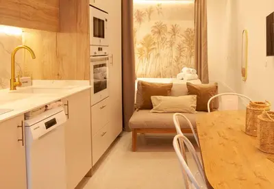 a kitchen with a table and a dining room at Estudio Bohemio Centro in Valencia