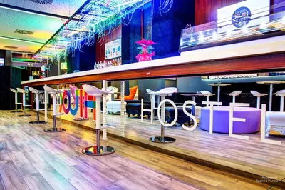 a store with a bar with stools on the floor at Urban Youth Hostel in Valencia