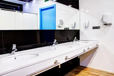 a bathroom with two sinks and a large mirror at Urban Youth Hostel in Valencia