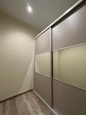 a walk in closet with sliding glass doors at Loft para 6 pax, 15 min de Ciencias y Artes y AC in Valencia