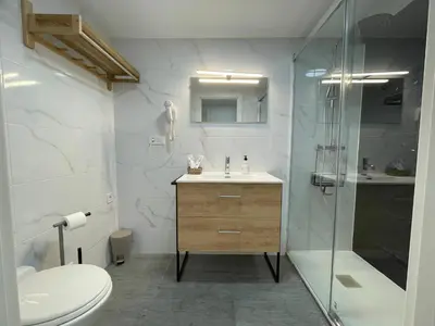 a bathroom with a toilet and a sink and a shower at MalvaLindaBeach Preciosa Casa Malvarrosa-Patacona in Valencia