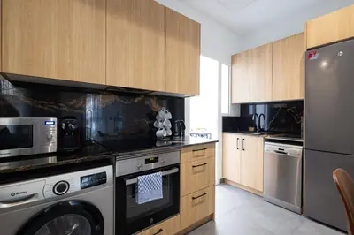 a kitchen with a stove and a dishwasher at FLORIT FLATS - The Patraix Apartments in Valencia