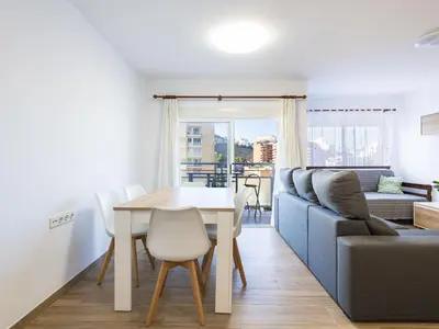 a living room with a table and a couch at Apartment Orion-2 by Interhome in Cullera