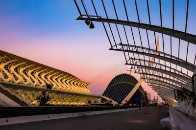 a dining room with a wooden table and chairs at APARTAMENTOS CIUDAD DE LAS ARTES Y LAS CIENCIAS in Valencia