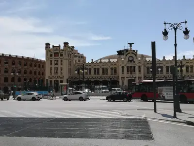 a large building with cars driving on a city street at Bam ! Centro ! Centre ! Zentrum ! in Valencia