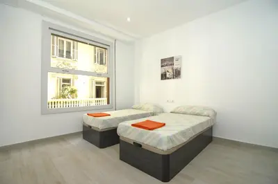 a living room with a red couch and a table at Bam ! Centro ! Centre ! Zentrum ! in Valencia
