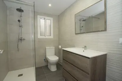 a bathroom with a toilet and a sink and a shower at Calm Company in Valencia