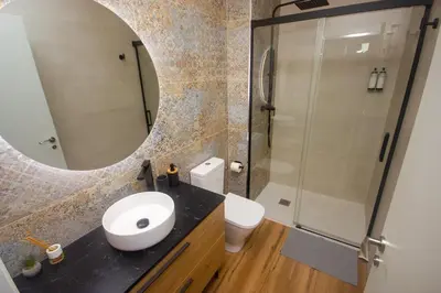 a bathroom with a sink and a mirror at Beach Apartments Valencia 2 in Valencia