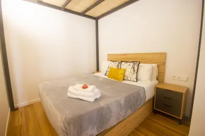 a bedroom with a bed with towels on it at Beach Apartments Valencia 2 in Valencia