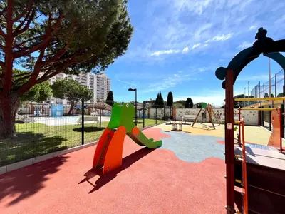 a playground with a slide in a park at Apartamento en la Playa Canet, muy cerca de Valencia in Canet de Berenguer