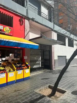 a fruit stand in front of a building at Precioso apartamento 2 personas in Valencia