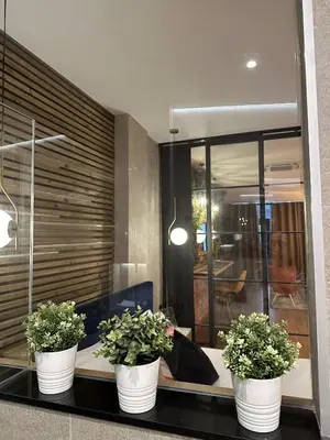 three potted plants sitting on a counter in a room at Fabulosa vivienda nueva a un paso de Plaza EspañA in Valencia