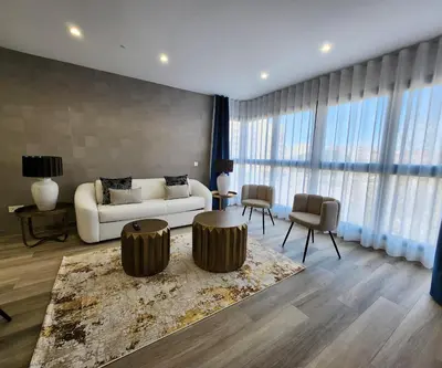 a living room with a couch and a table and chairs at MD Pont de Fusta in Valencia