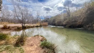 a river with rapids on the side of it at La Casica de los Abuelos By El Conserje in Pedralba