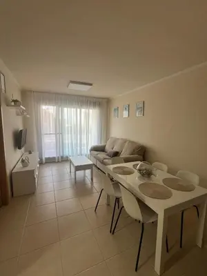 a living room with a couch and a table at Apartamento en Playa moncófar a tan solo 300 metros in Moncófar