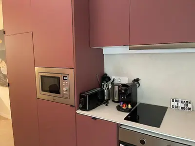 a kitchen with a counter with a microwave and a microwave at Osito Hub - Pintor Nicolau in Valencia