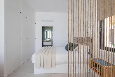 a white bedroom with a bed and a window at FLORIT FLATS - Stylish Studio by the Joaquin Sorolla Station in Valencia