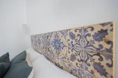 a headboard with a blue and white pattern on it at FLORIT FLATS - Stylish Studio by the Joaquin Sorolla Station in Valencia