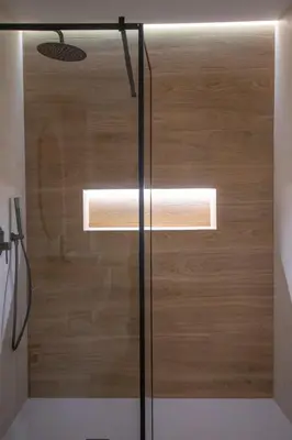 a shower with a glass door in a bathroom at BedTime Suites by Concept Flats in Valencia